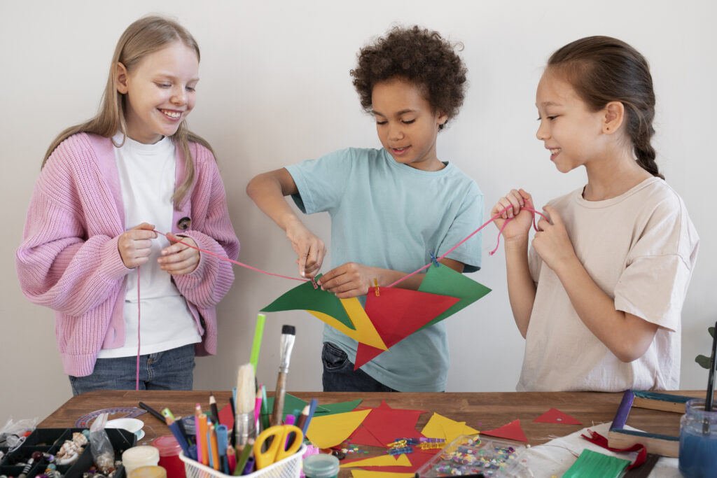 young kids making diy project from upcycled materials